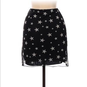 New with tag. Nasty Gal black and white star mesh mini skirt. Size USA 14.